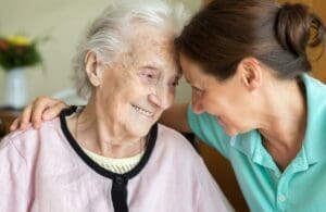 lady with dementia being cared for by a live in carer