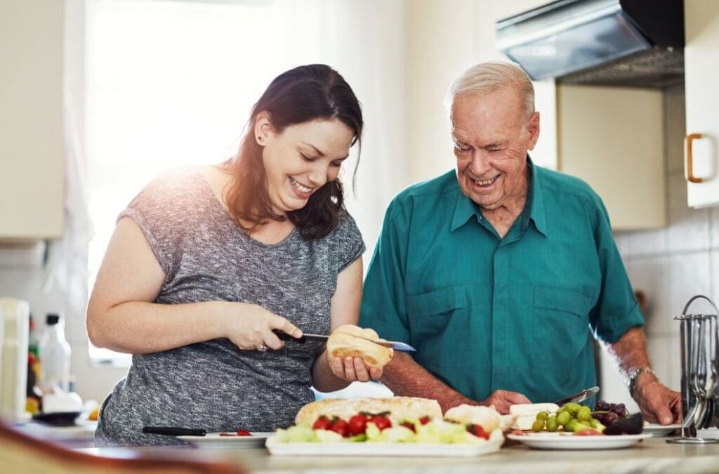 woman cutting food with her father